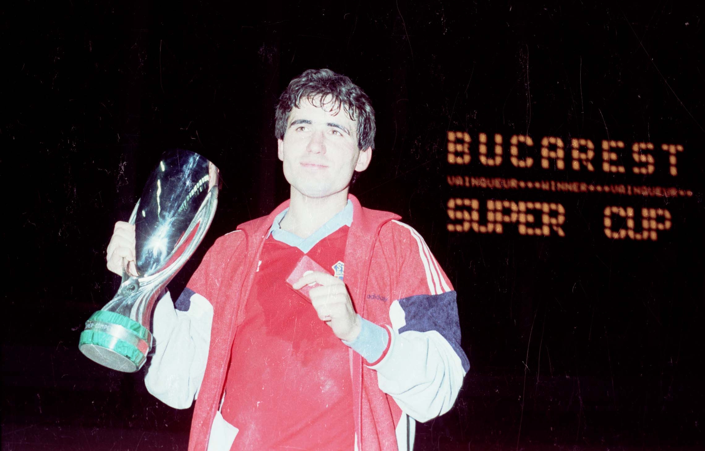 Gheorghe Hagi posing with the UEFA Super Cup, a trophy won thanks to his free kick goal against Dinamo Kiev, on February 24th 1987